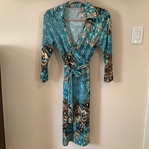 Long sleeve turquoise, tan and brown dress.